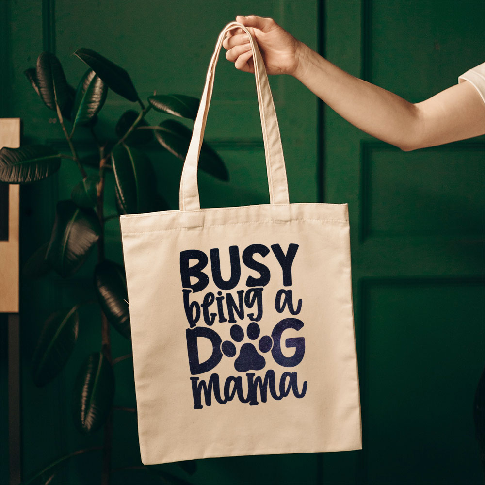 Busy Being A Dog Mama With Green Galaxy Font Totes at $22.95 found at Personalizedpetlovergifts