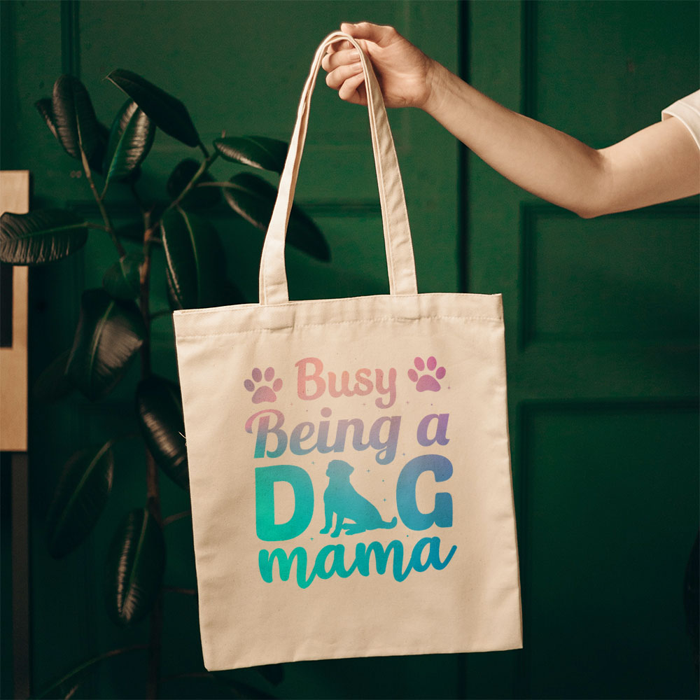 Busy Being A Dog Mama With Paw With Blue Paint Font Totes at $22.95 found at Personalizedpetlovergifts