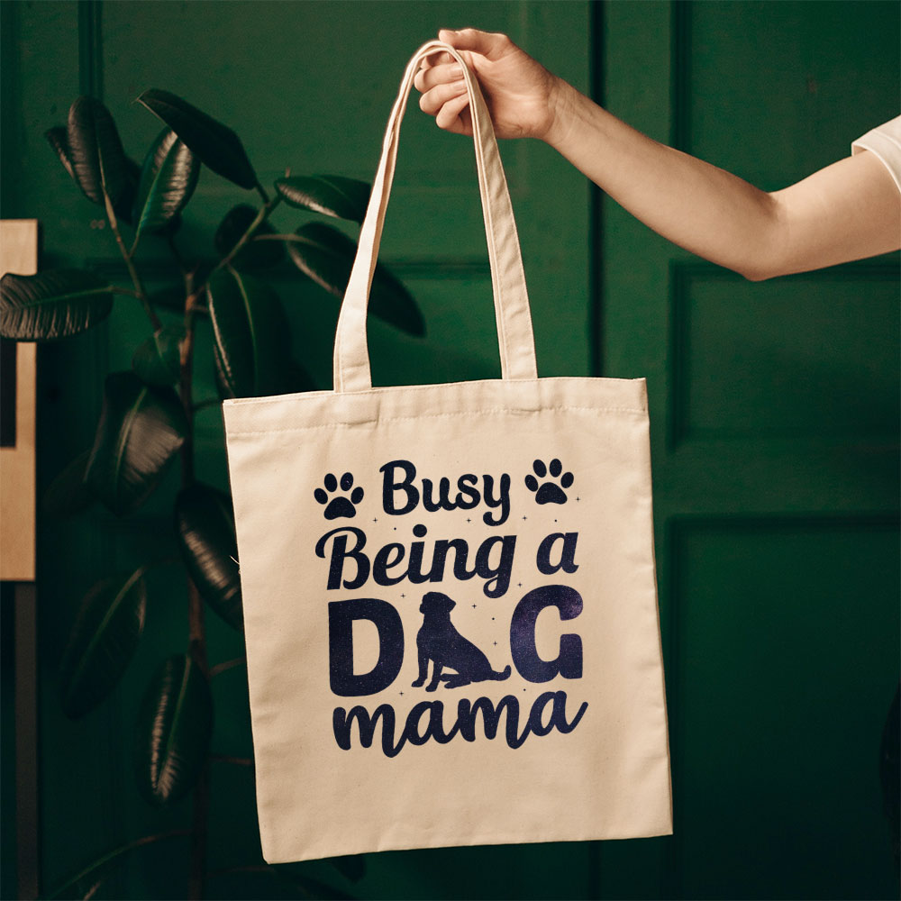 Busy Being A Dog Mama With Paw With Green Galaxy Font Totes at $22.95 found at Personalizedpetlovergifts