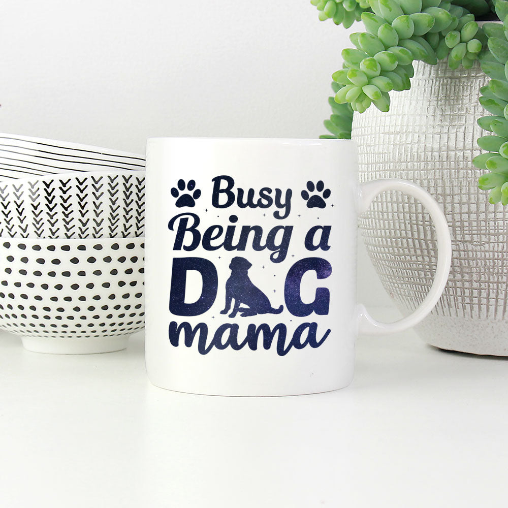 Busy Being A Dog Mama With Paw with Green Galaxy font Mugs at $13.95 found at Personalizedpetlovergifts