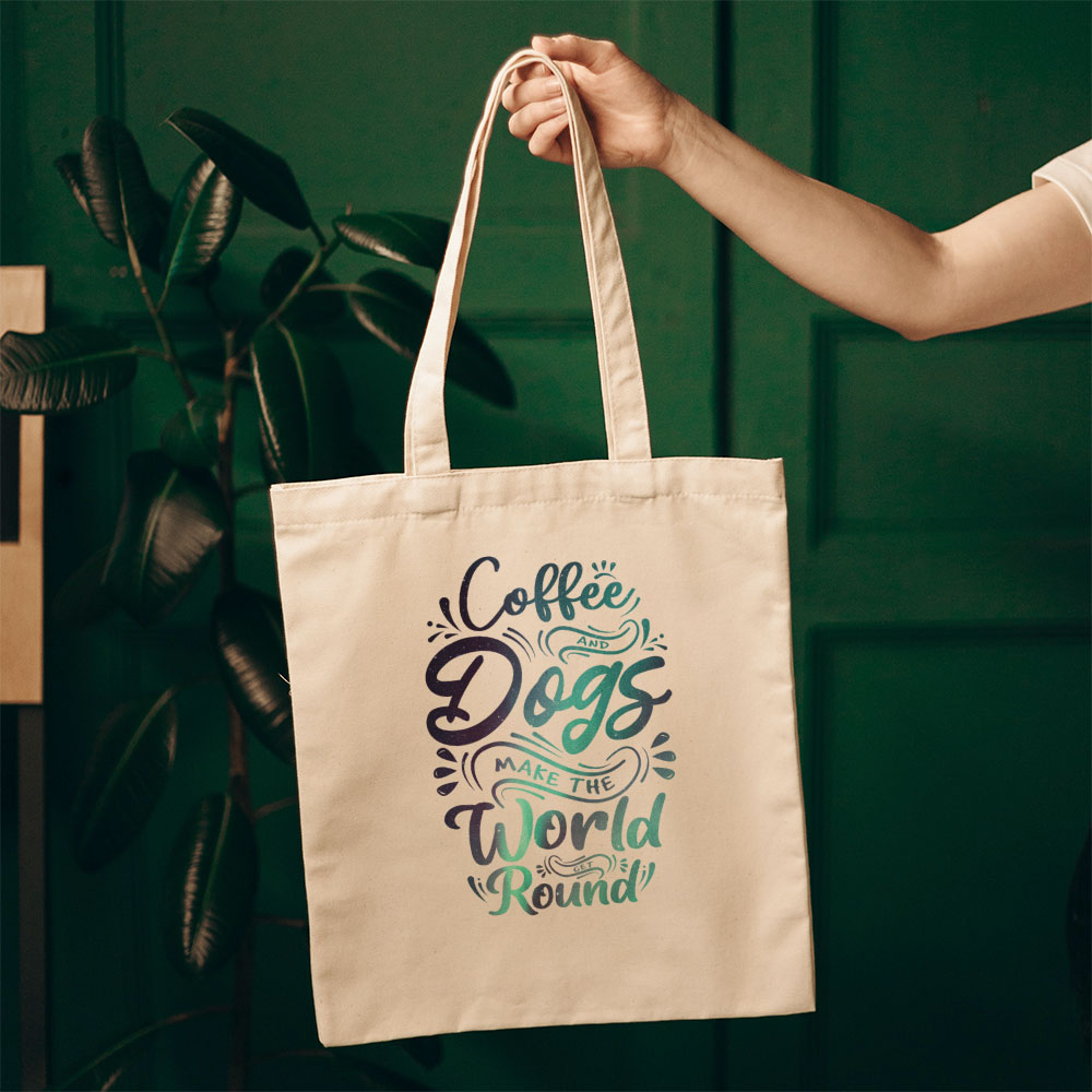 Coffee And Dogs Make The World Go Round With Green Galaxy Font Totes at $22.95 found at Personalizedpetlovergifts