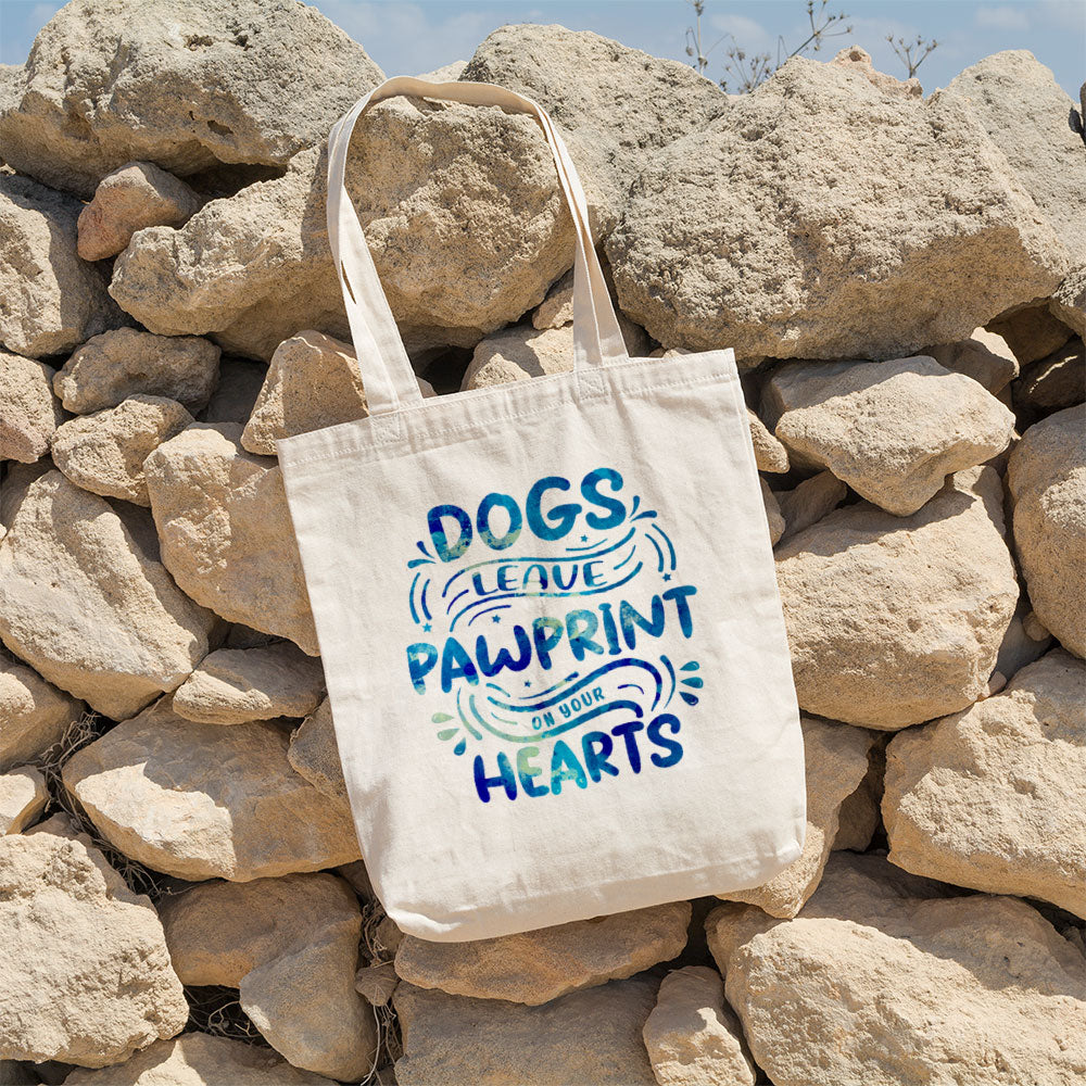 Dogs Leave Pawprints On Your Hearts With Blue Paint Font Totes at $22.95 found at Personalizedpetlovergifts