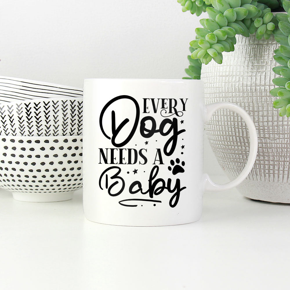 Every Dog Needs A Baby Mugs at $13.95 found at Personalizedpetlovergifts