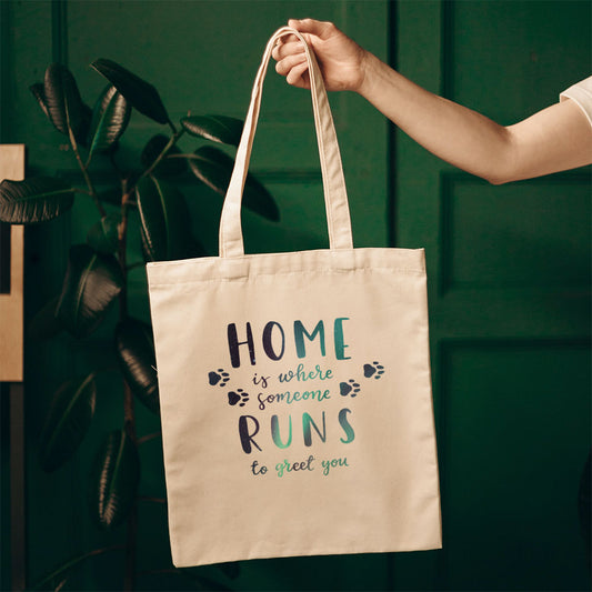 Home Is Where Someone Runs To Greet You With Paws Totes at $22.95 found at Personalizedpetlovergifts