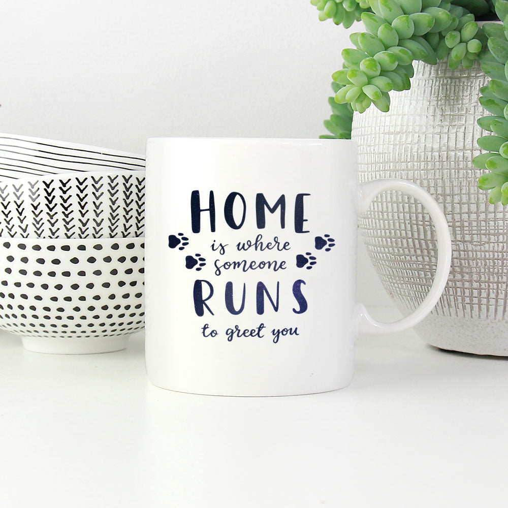 Home Is Where Someone Runs To Greet You With Paws with Green Galaxy font Mugs at $13.95 found at Personalizedpetlovergifts