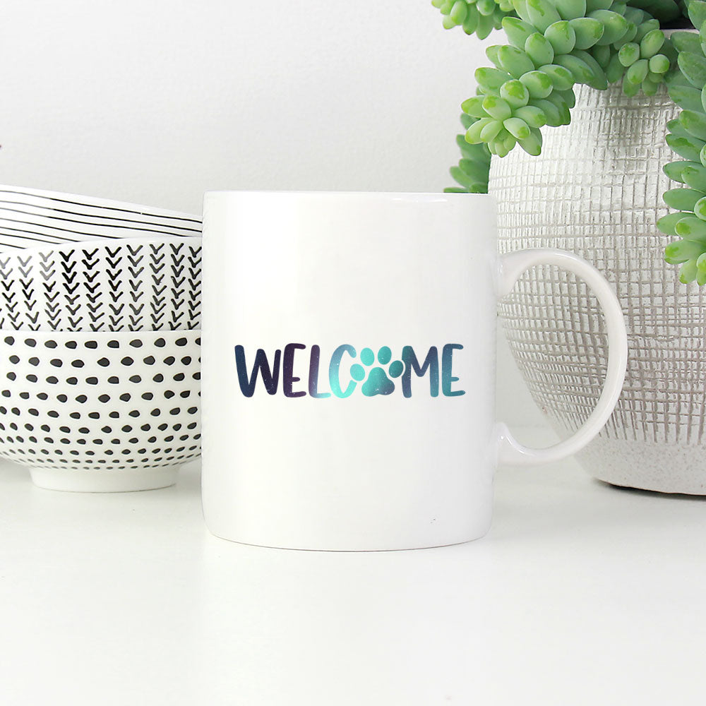 Welcome Paw with Green Galaxy font Mugs at $13.95 found at Personalizedpetlovergifts