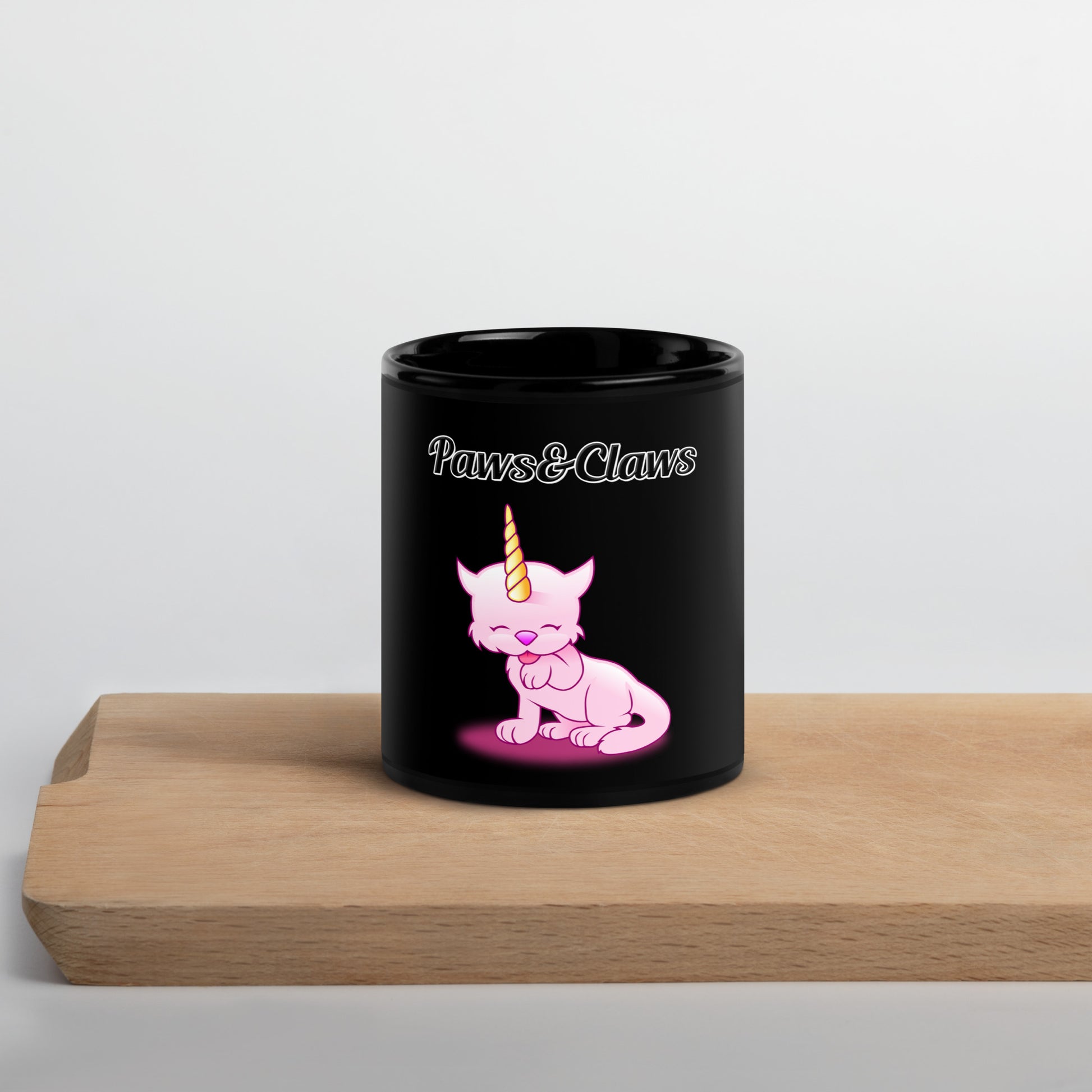 Black Glossy Mug with text Unicorn Cat Licking Its Paw with a text "Paws&Claws" at $17.99 found at Personalizedpetlovergifts