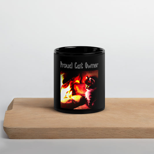 Black Glossy Mug with Kitten Warming Up Near The Fire with a text "Proud Cat Owner" at $25.97 found at Personalizedpetlovergifts