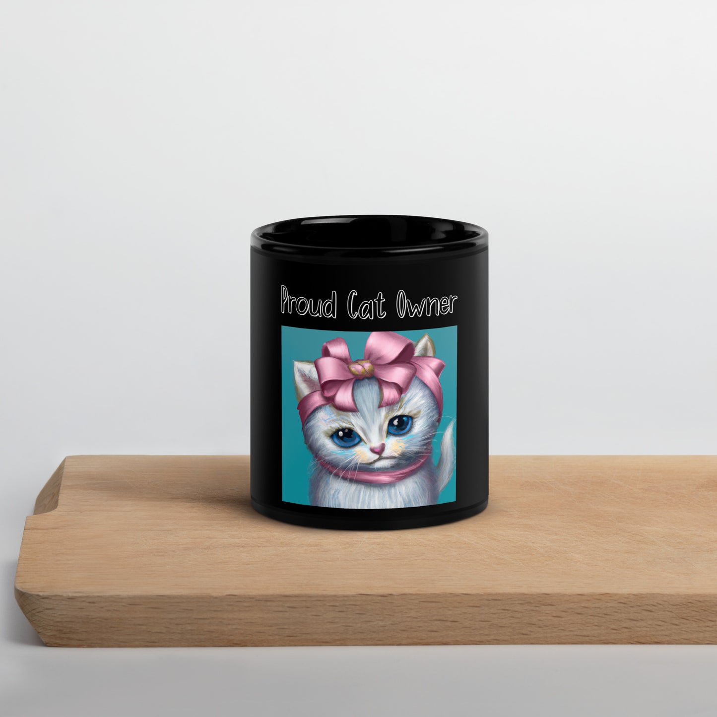 Black Glossy Mug with Kitten Portrait With a Pink Bow with a text "Proud Cat Owner" at $25.97 found at Personalizedpetlovergifts