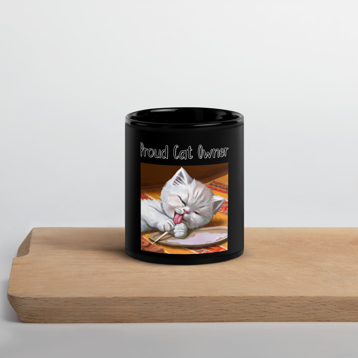 Black Glossy Mug with Kitten Licking Its Paws with a text "Proud Cat Owner" at $25.97 found at Personalizedpetlovergifts