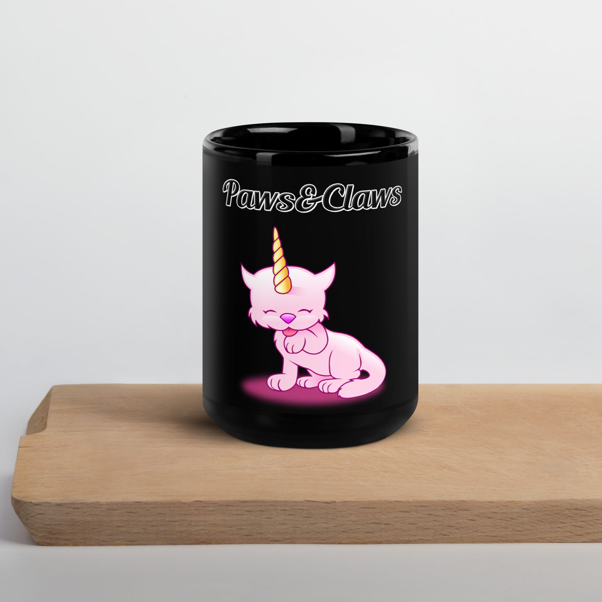 Black Glossy Mug with text Unicorn Cat Licking Its Paw with a text "Paws&Claws" at $17.99 found at Personalizedpetlovergifts